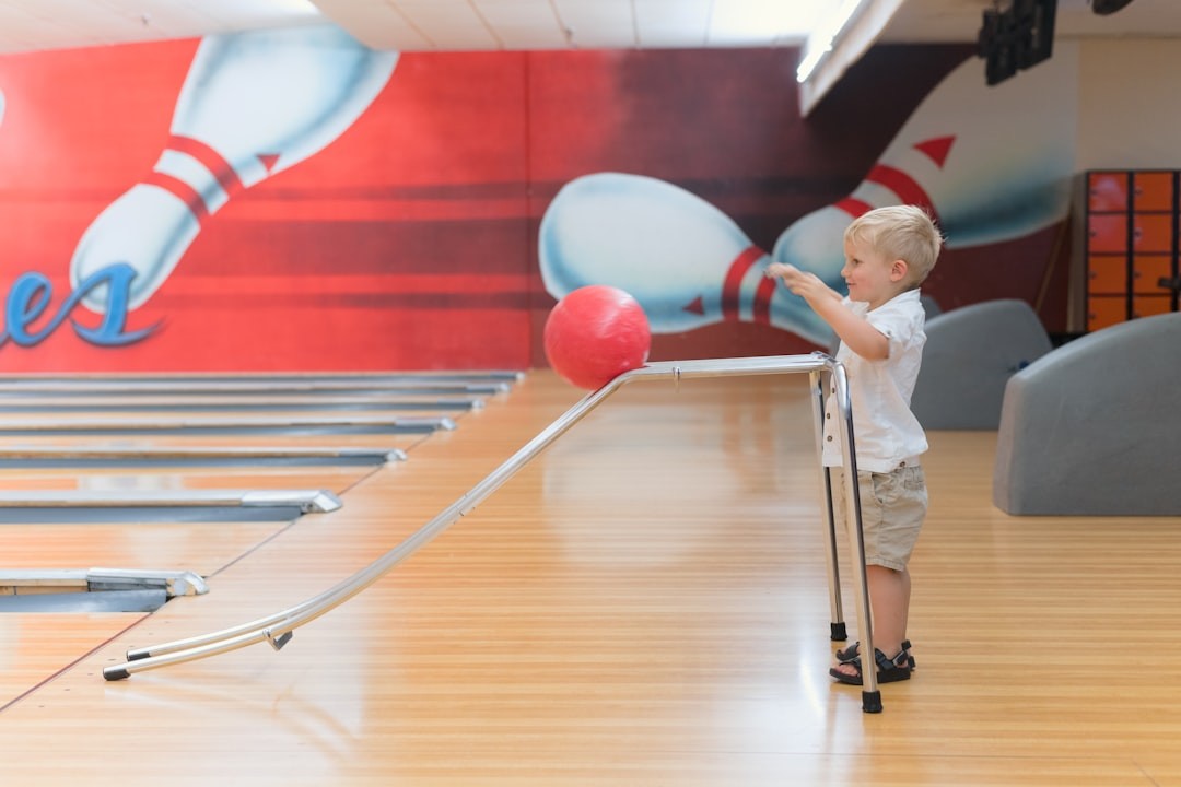 child bowling with ramp